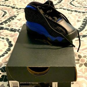 Size 4c Jordan 13 Retro sneakers.